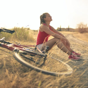 Therapy for Stress & Burnout - girl relaxing in field